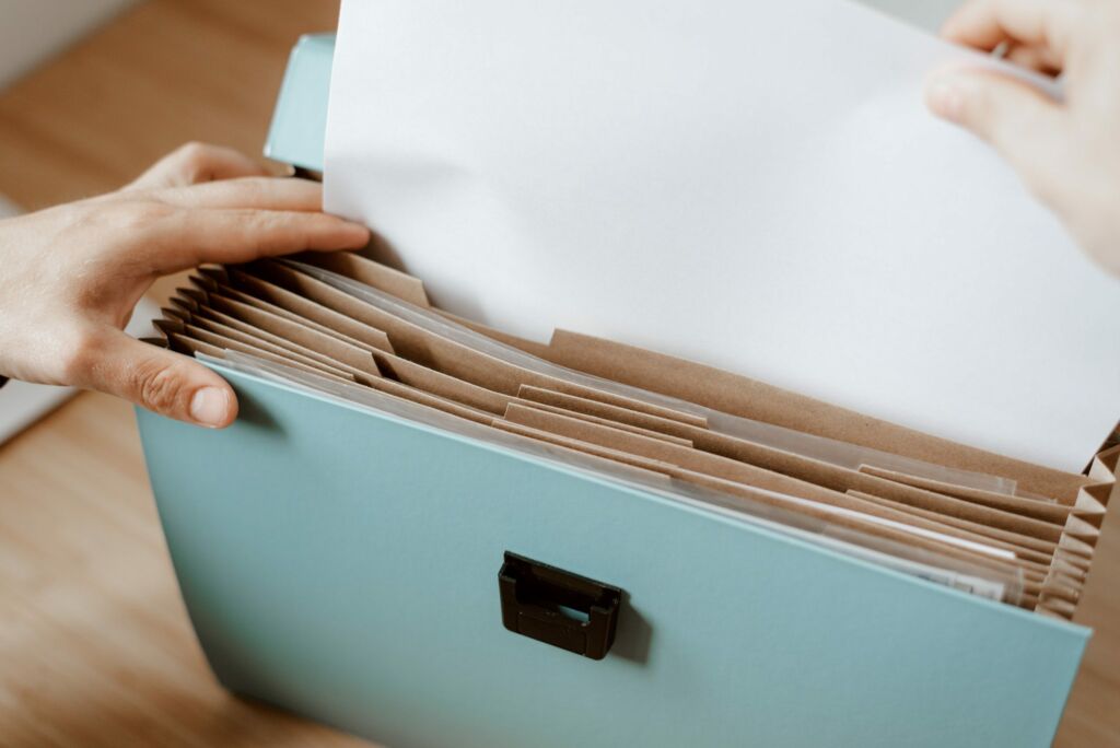 Man looks through folder for support