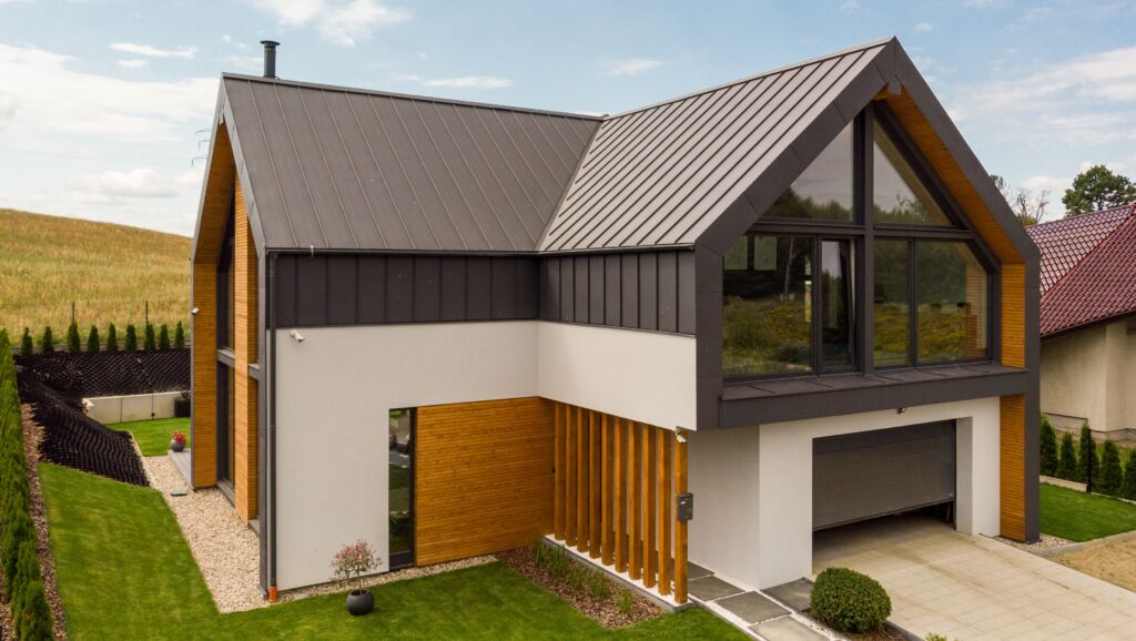Modular housing construction - prefabricated house  in a modern barn style