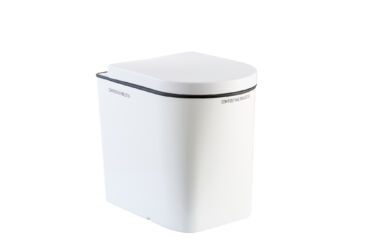 composting separating toilet with white toilet desk