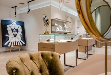 The display tables with drawers and a glass dome, and the hanging cabinets with shelves for displays