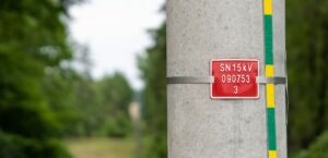 Number plate mounted using stainless steel tape.