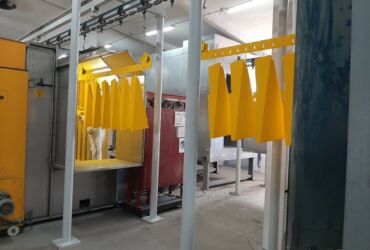 Powder coating of machine bodies and train elements.