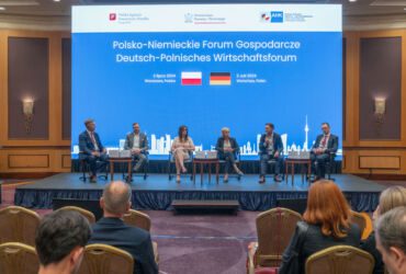 On-stage panel discussion with five panellists