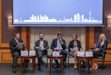 On-stage panel discussion with five panellists