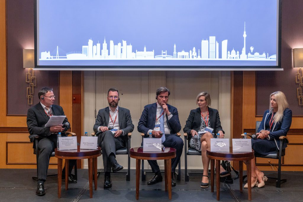 On-stage panel discussion with five panellists