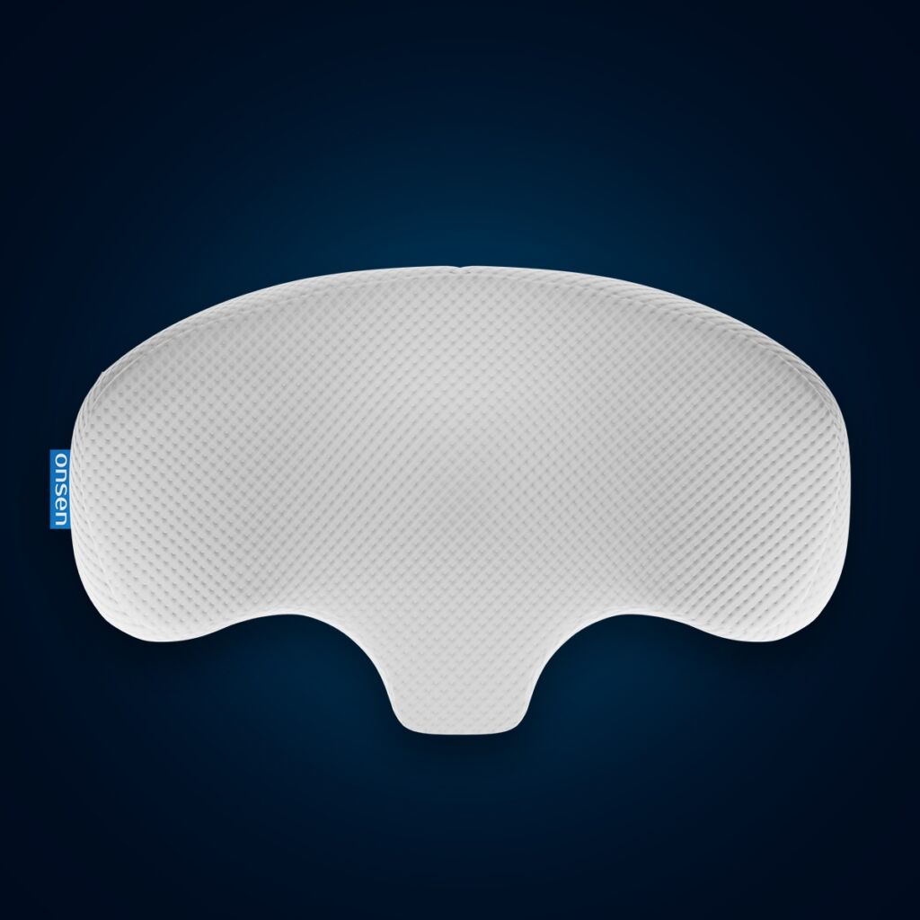 Product photo of the Asana orthopedic pillow by ONSEN®, featuring its ergonomic shape.