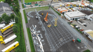 Steel hall for industrial use with durable structure, large access doors, and fast installation capability.