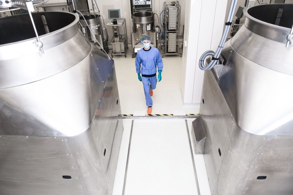 GMP facility with large-scale Kuhner stainless steel bioprocess equipment for biologics manufacturing services.