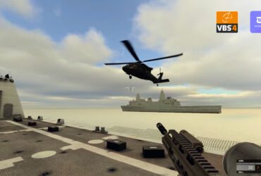 The photo depicts a VBS training simulation – featuring a weapon and a helicopter