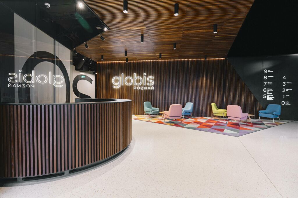 Reception area in an office building made of thermally modified ash, Poznań, Poland