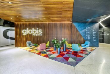 Reception area in an office building made of thermally modified ash, Poznań, Poland