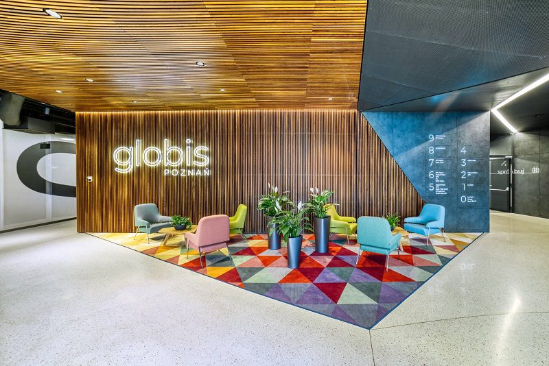 Reception area in an office building made of thermally modified ash, Poznań, Poland